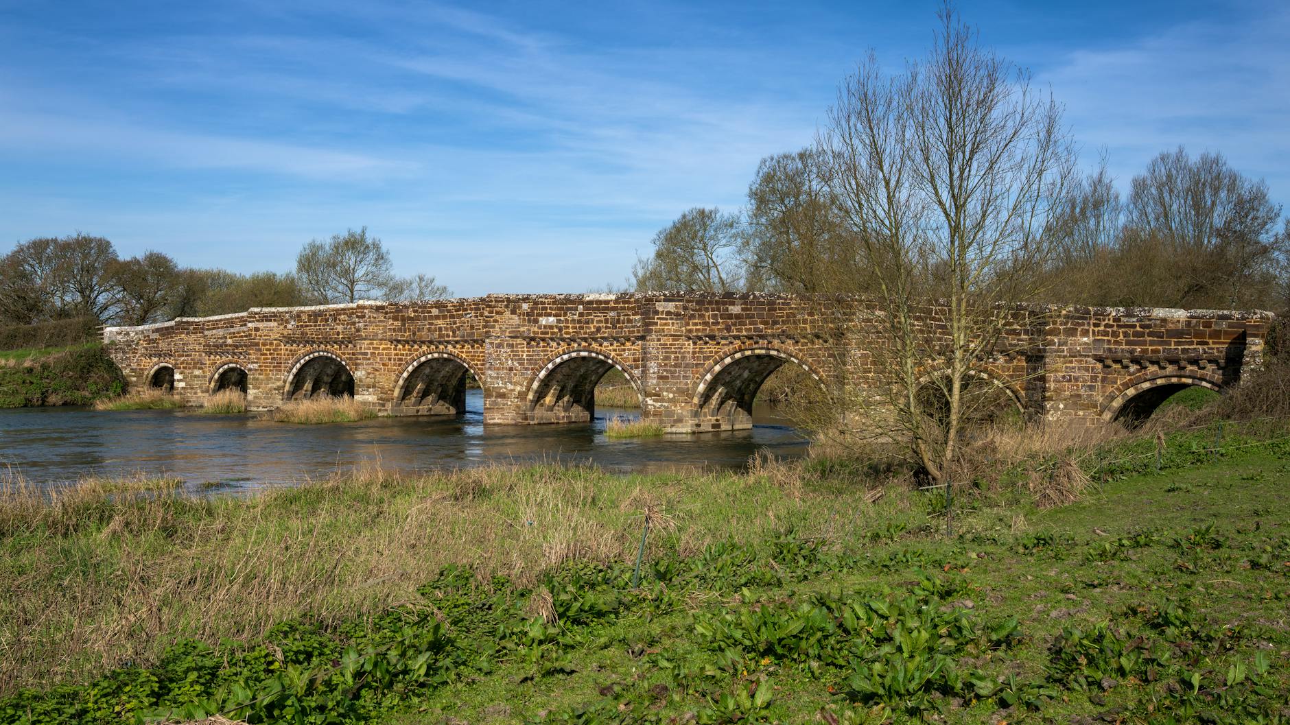 Low stone bridges crossing the River Windrush in Bourton-on-the-Water