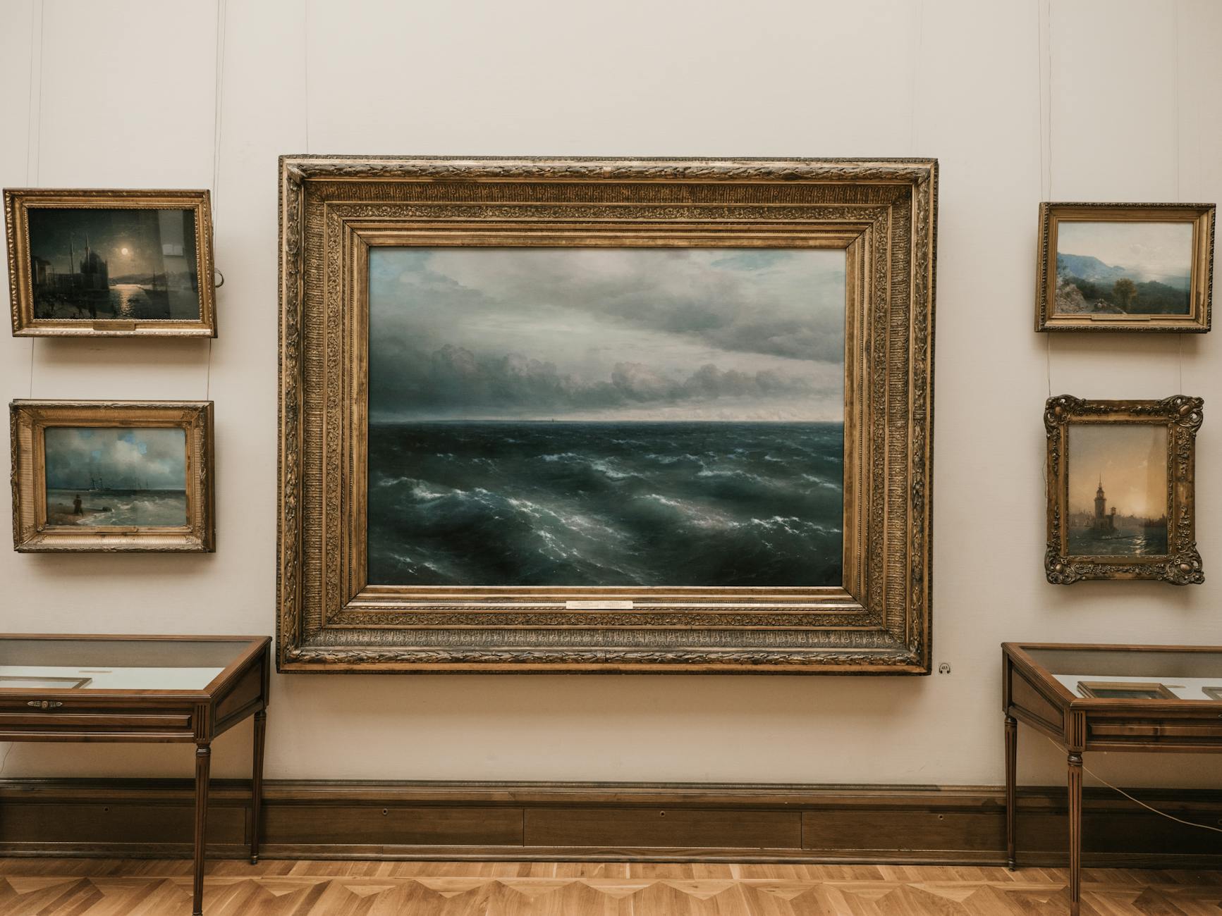Paintings on display in a light-filled art gallery