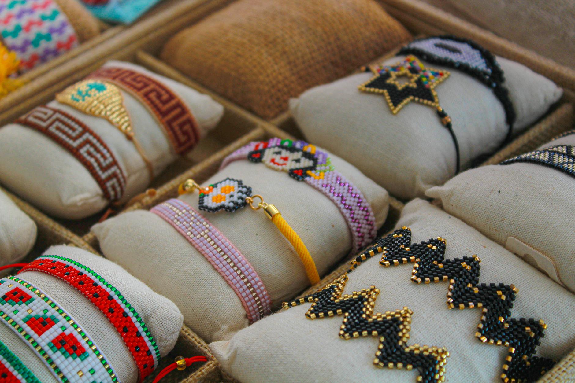 Handmade jewellery and crafts on display at an artisan market