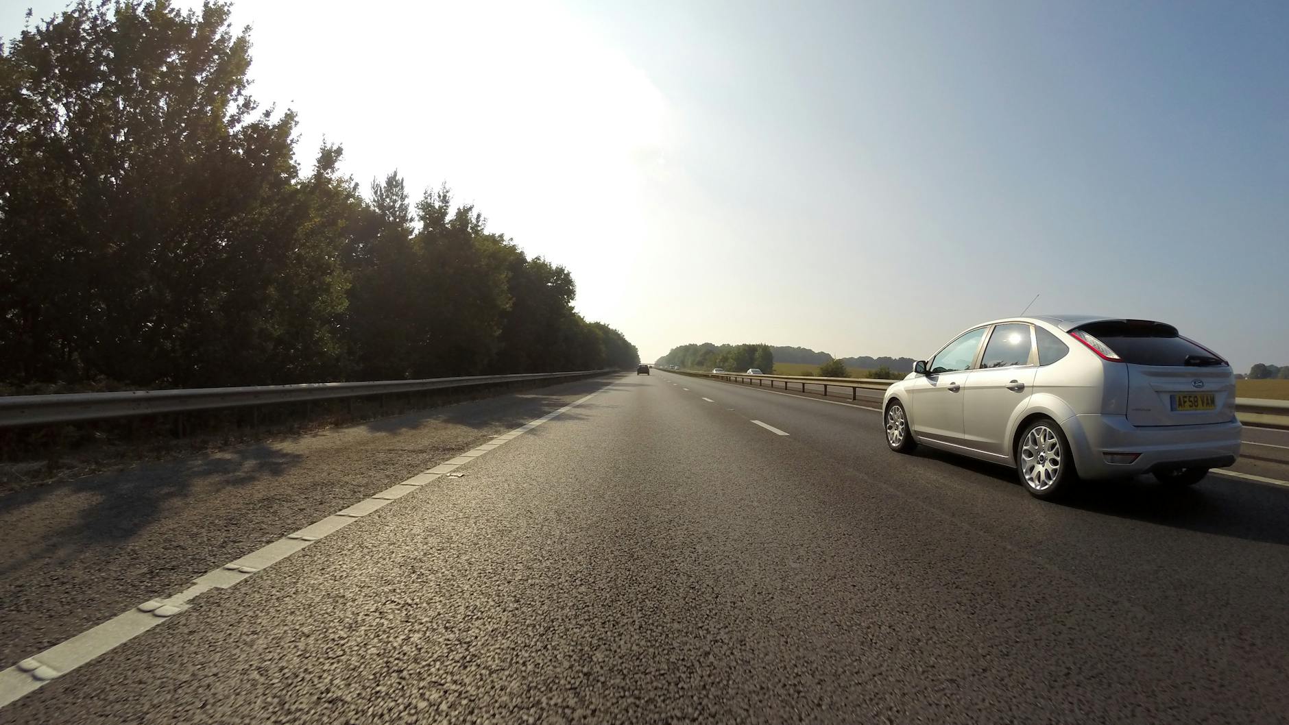 A scenic country road winding through the rolling English countryside