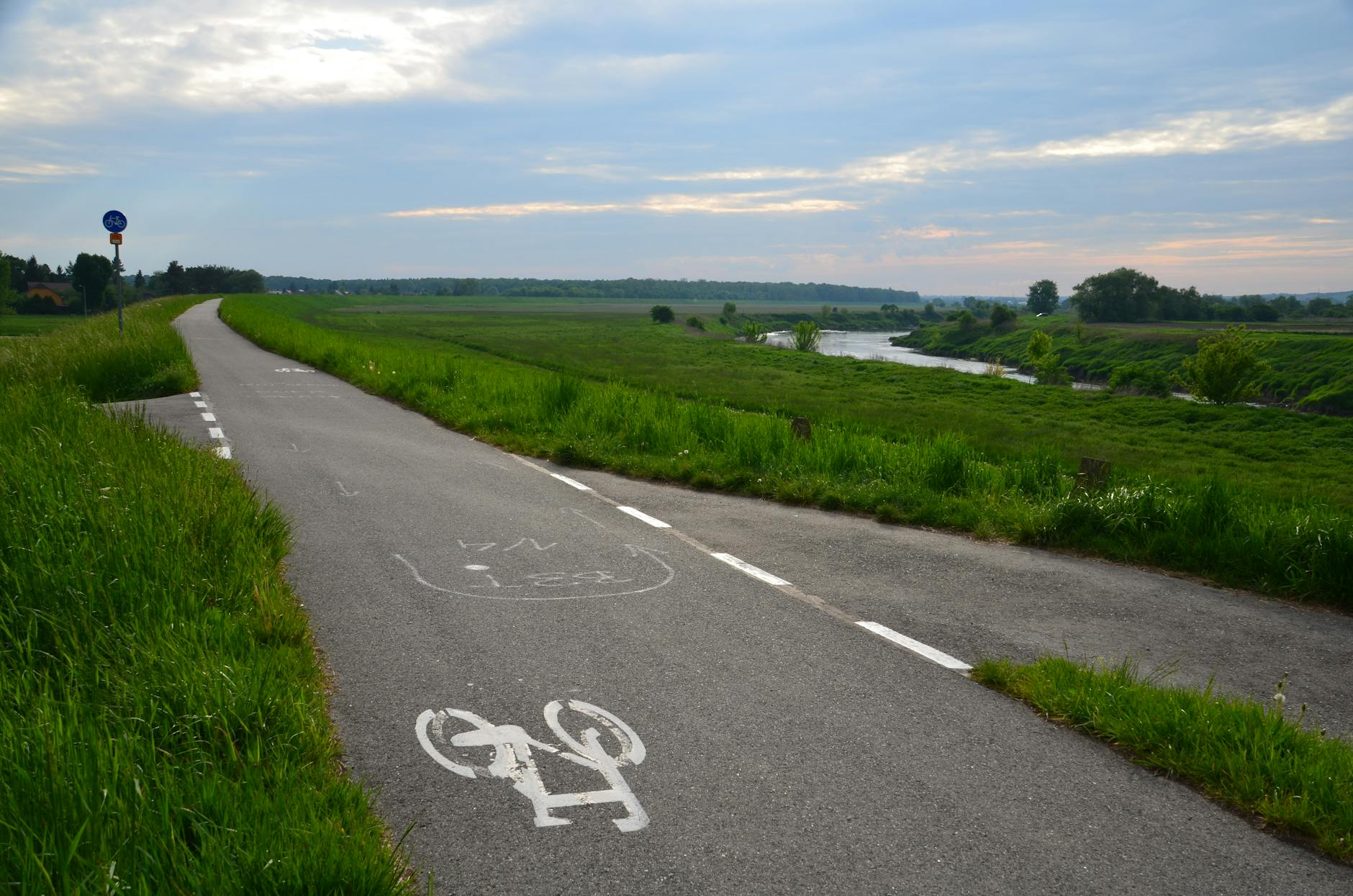 Cyclists riding along quiet rural lanes through the English countryside