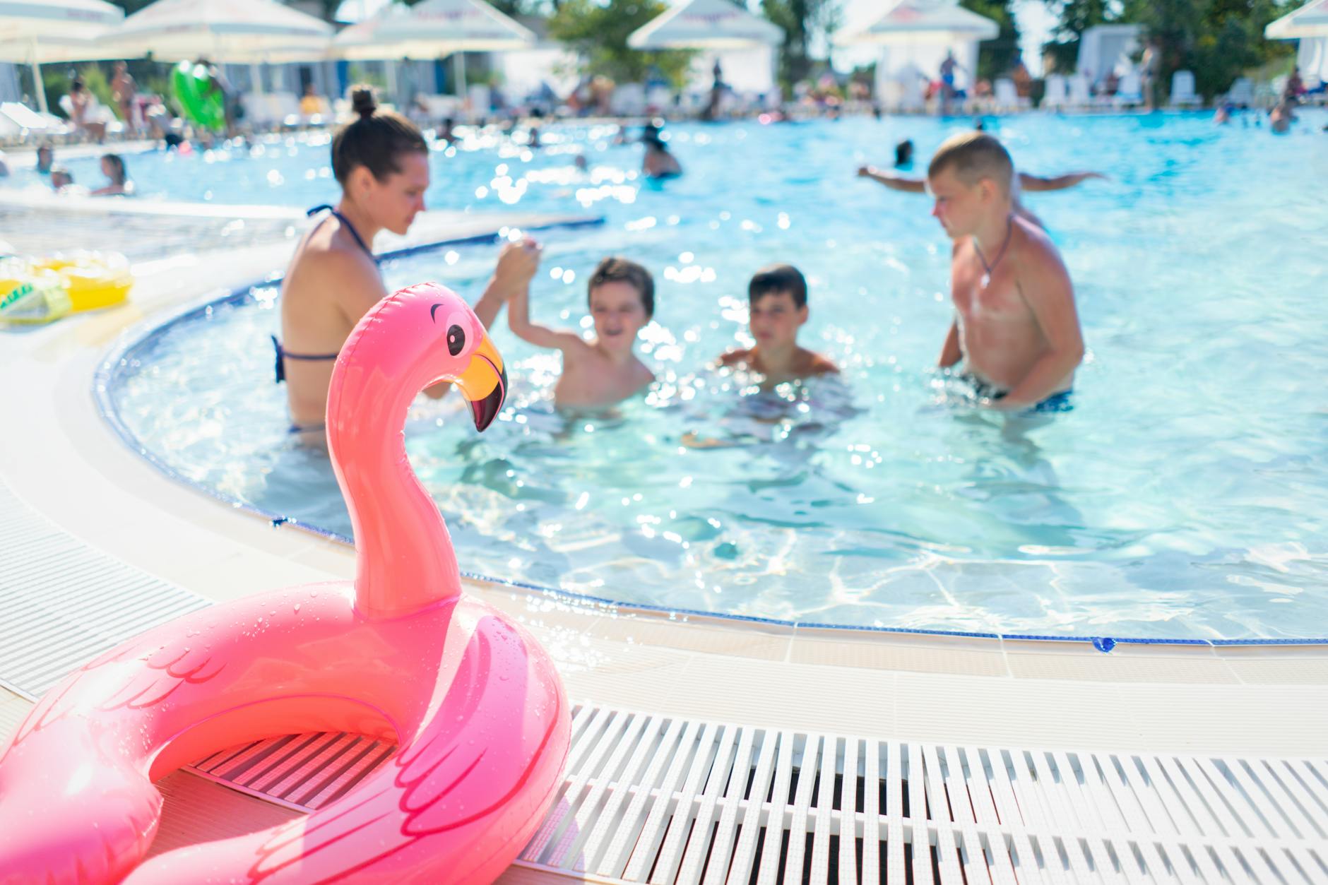 Families enjoying a swimming pool at a family-friendly Cotswolds hotel
