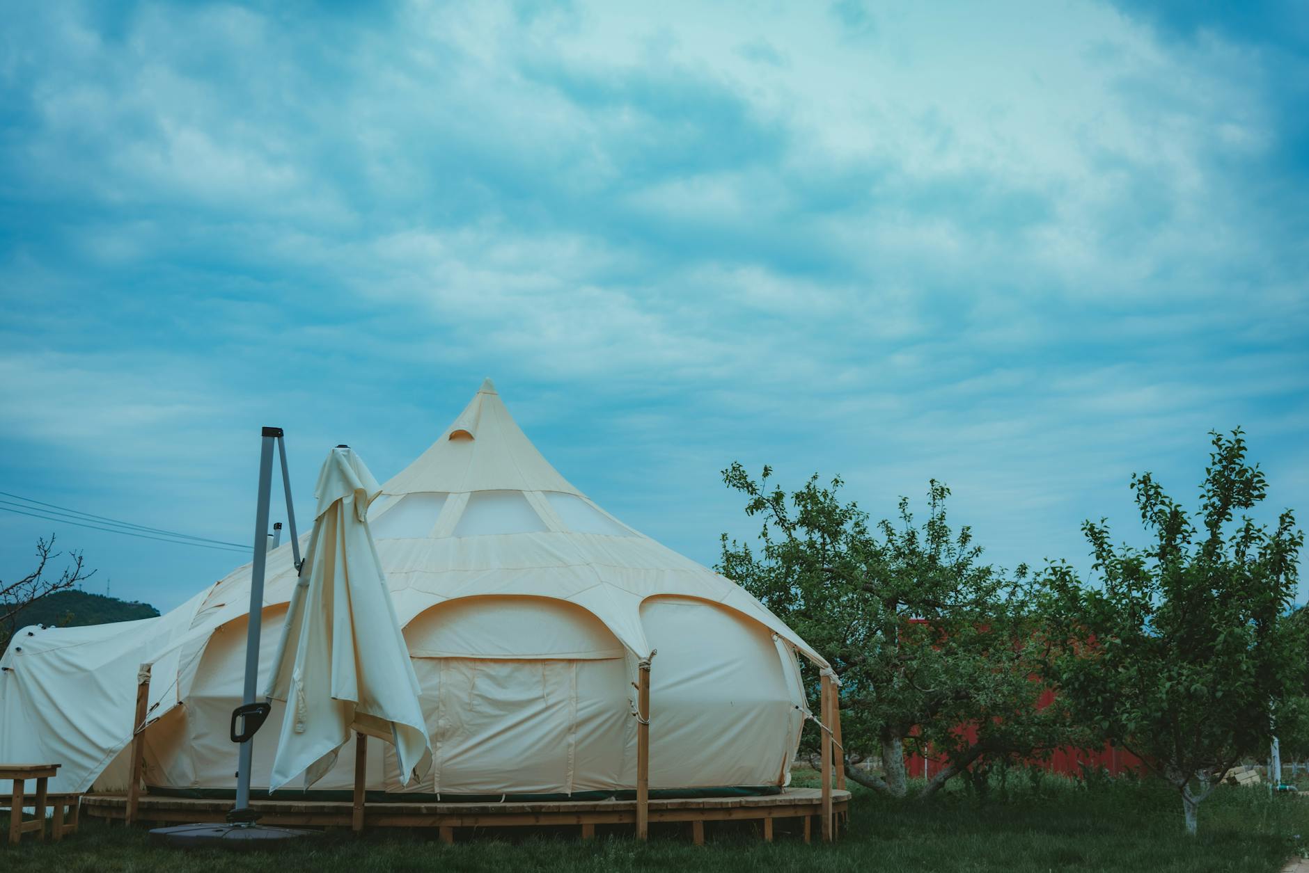 A luxury glamping bell tent set in the rolling Cotswolds countryside