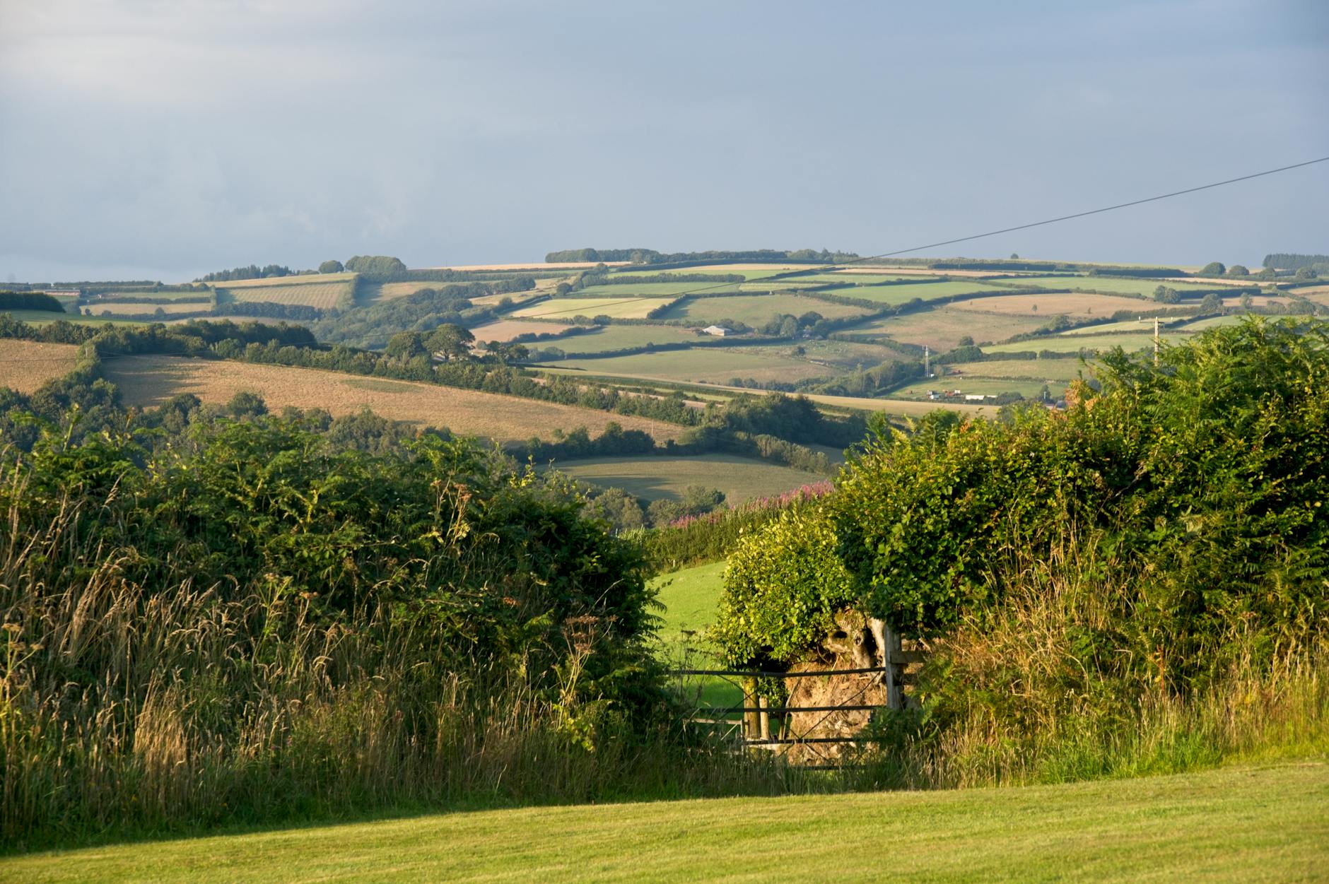 A hotel room with panoramic views across the rolling Cotswolds countryside
