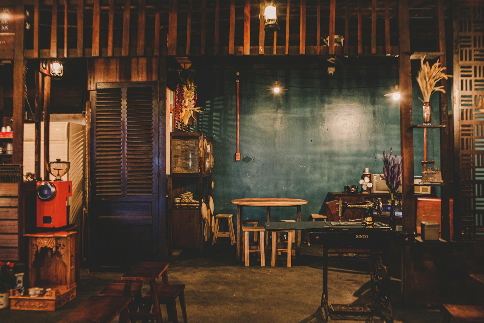 A warm, rustic coffee shop interior with wooden furniture and vintage touches
