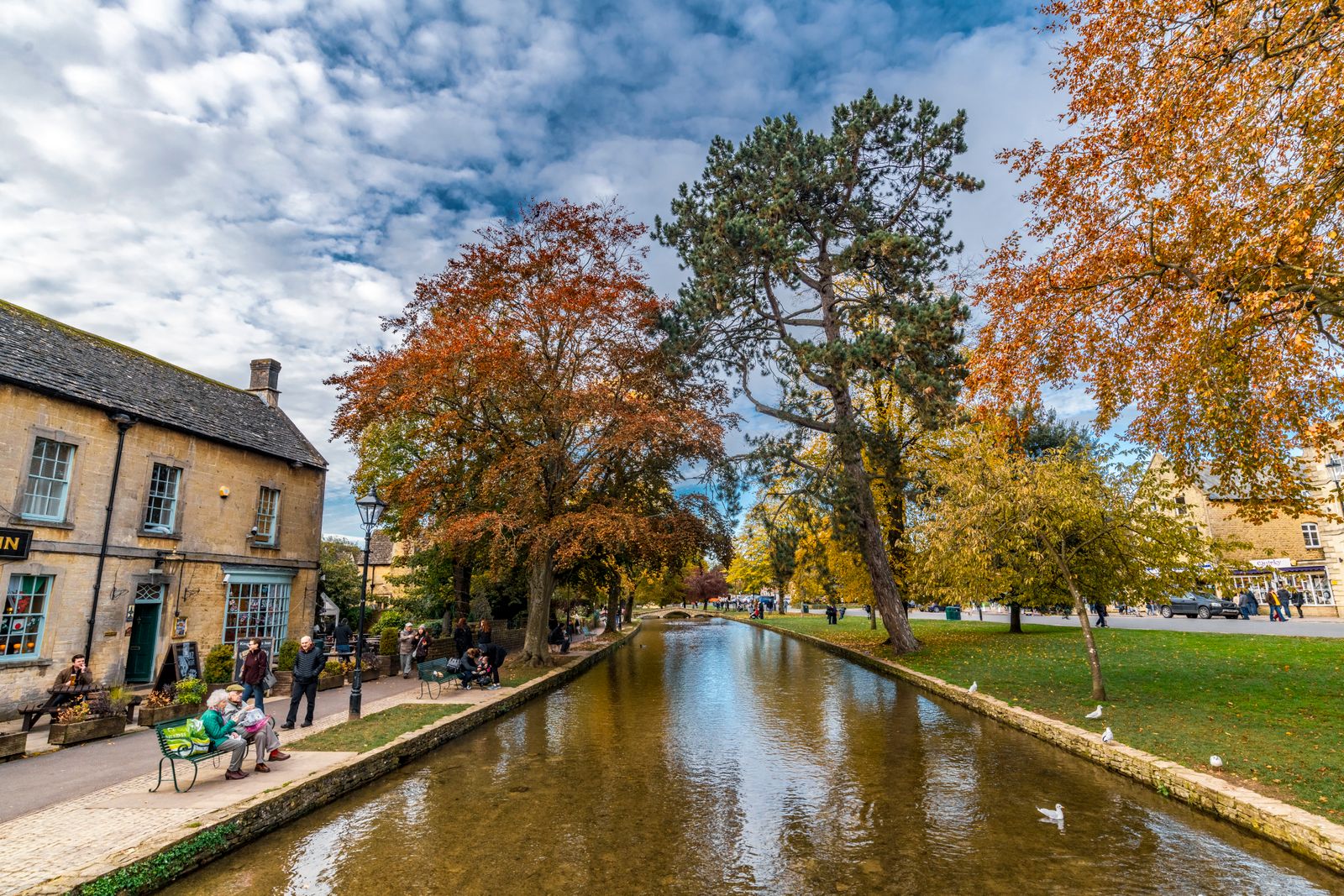 Low stone bridges over the River Windrush at Bourton-on-the-Water in autumn