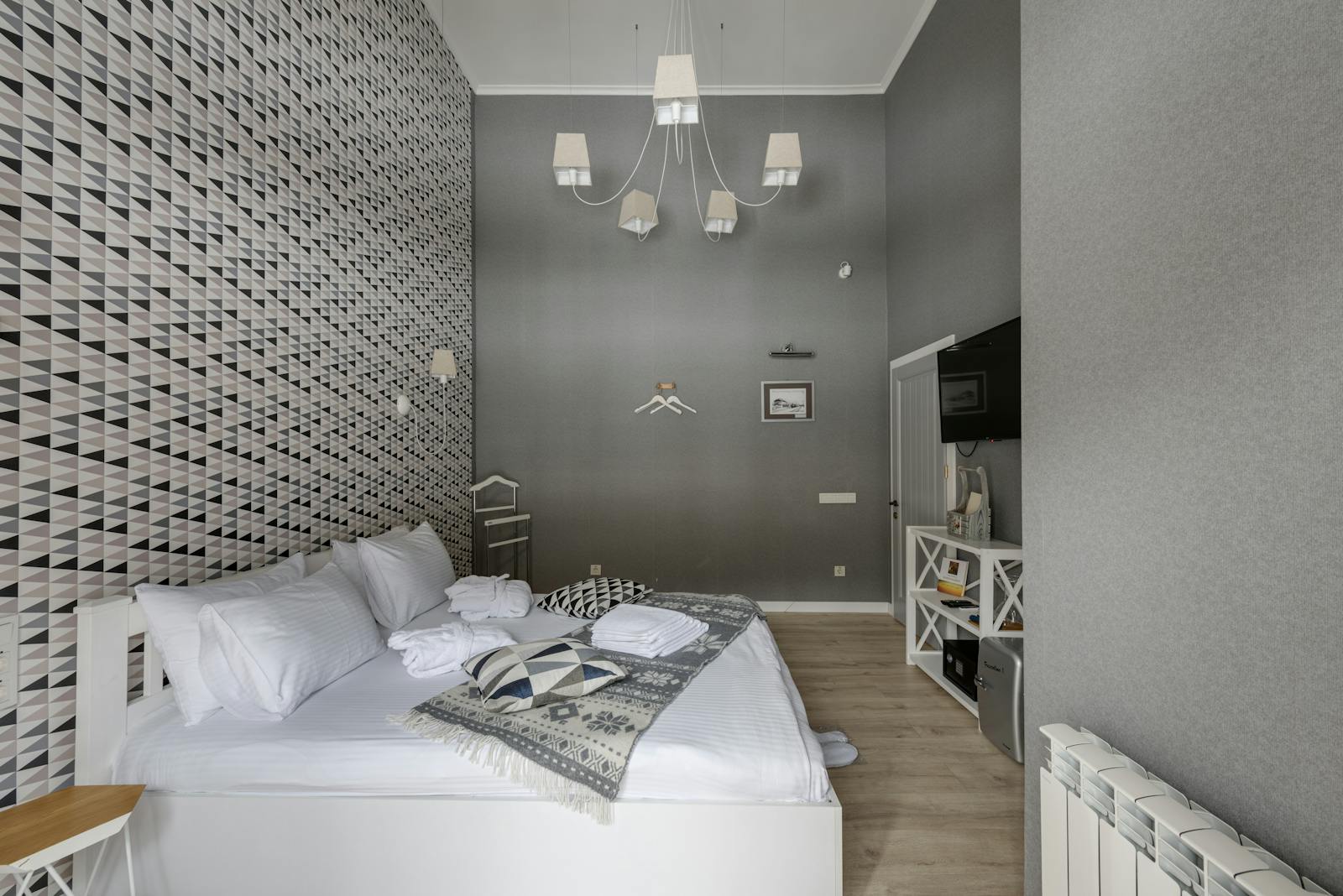 A stylish boutique hotel bedroom with modern decor and a comfortable bed