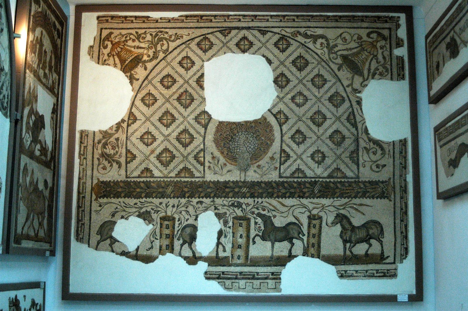An intricate Roman mosaic featuring horses and geometric patterns