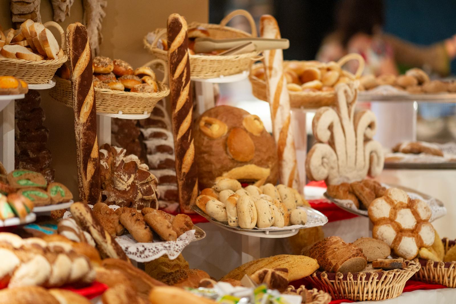 A colourful display of artisan breads and pastries in a bakery