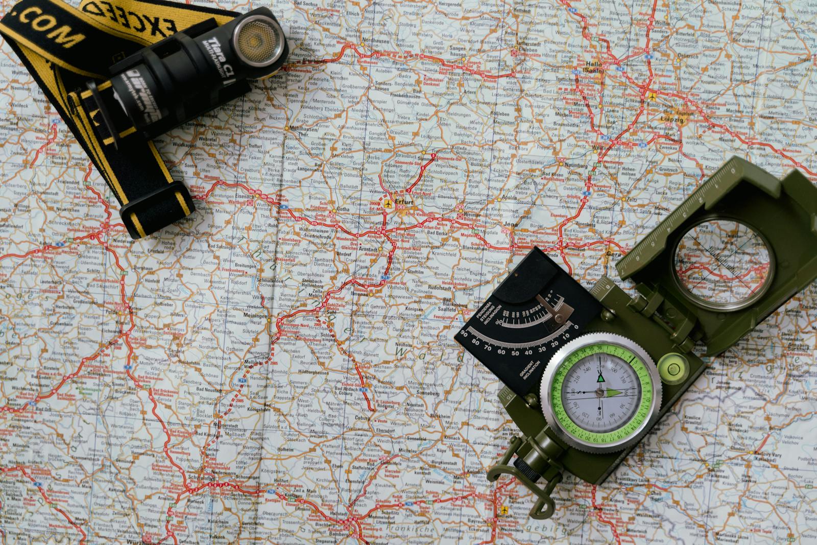 A walker planning a Cotswold Way route with a map and notes