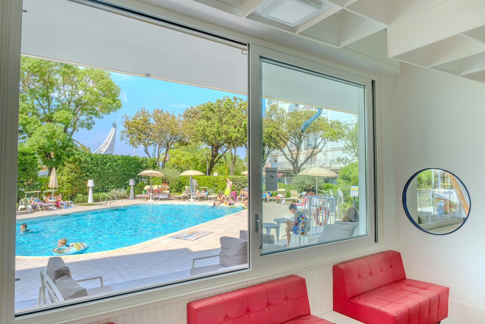 A bright hotel pool and lounge area perfect for families