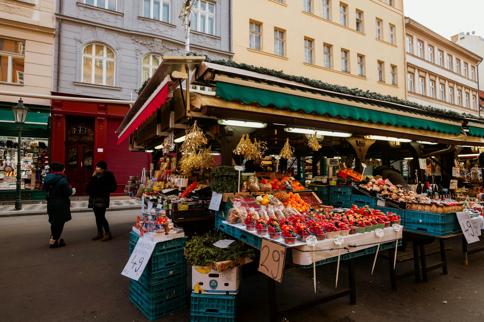 Colourful fruit and vegetable stalls at a busy British open-air street market