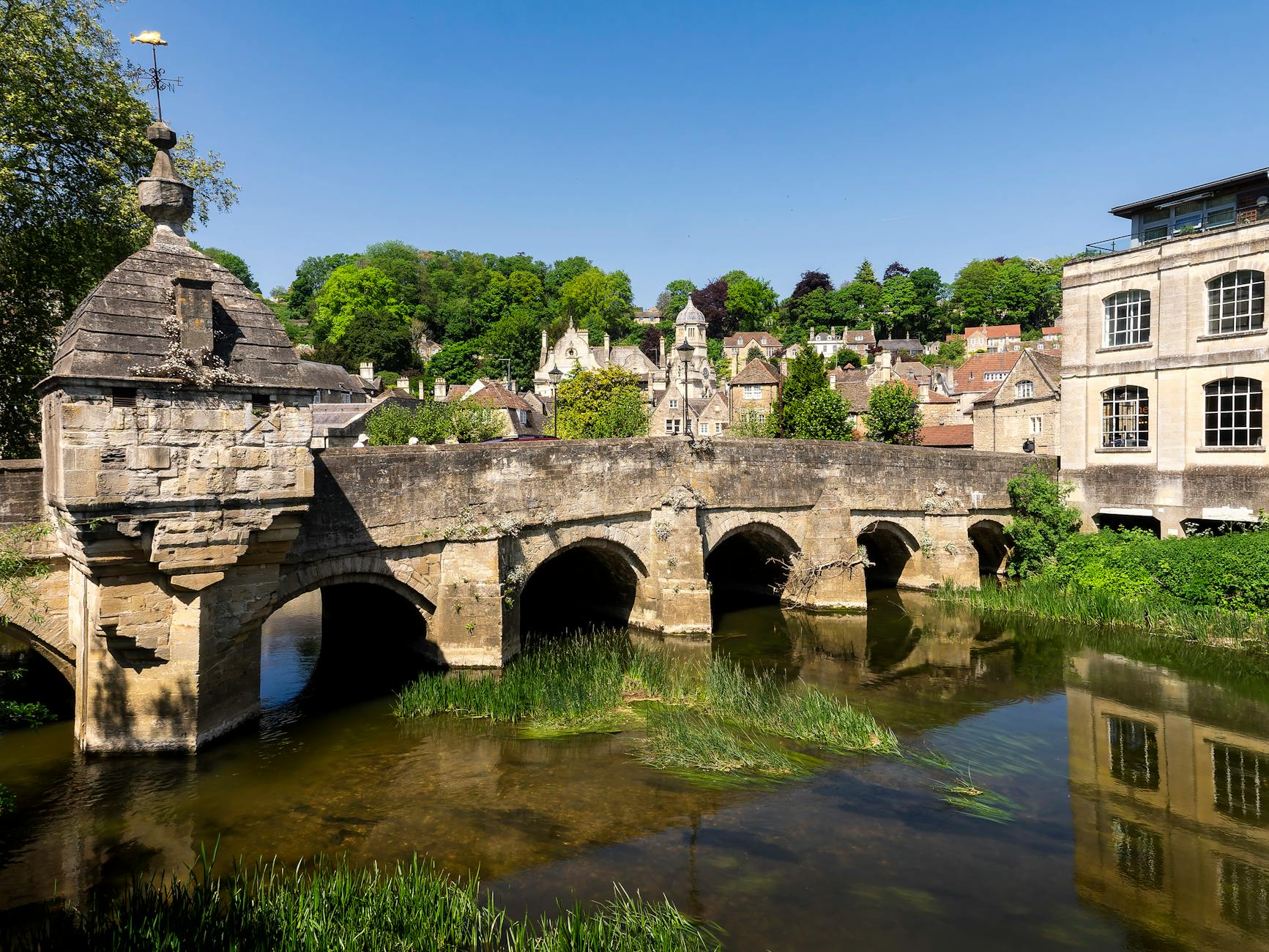 A honey-stone bridge over a Cotswold river
