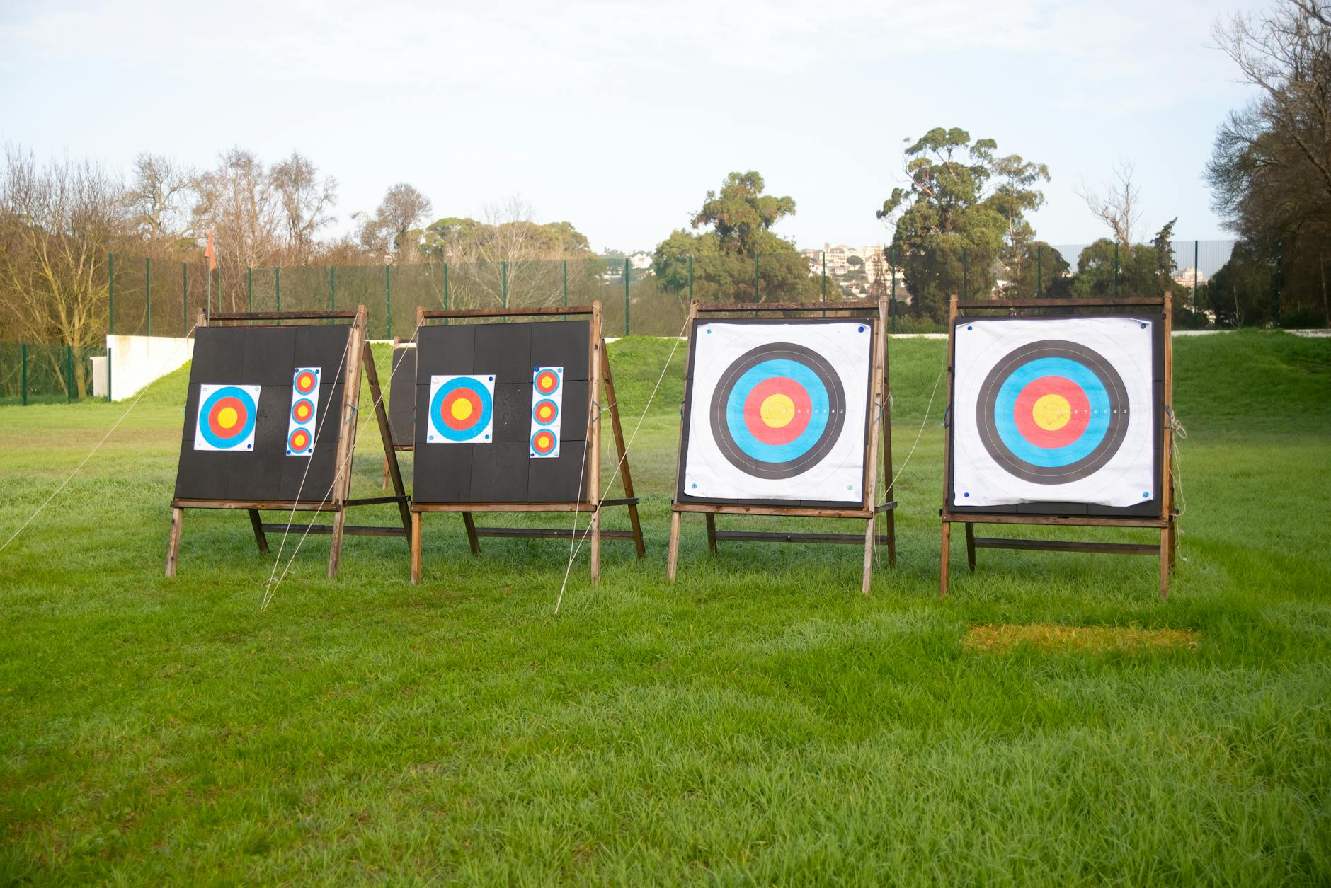 Archery targets set up on a grassy field on a sunny day