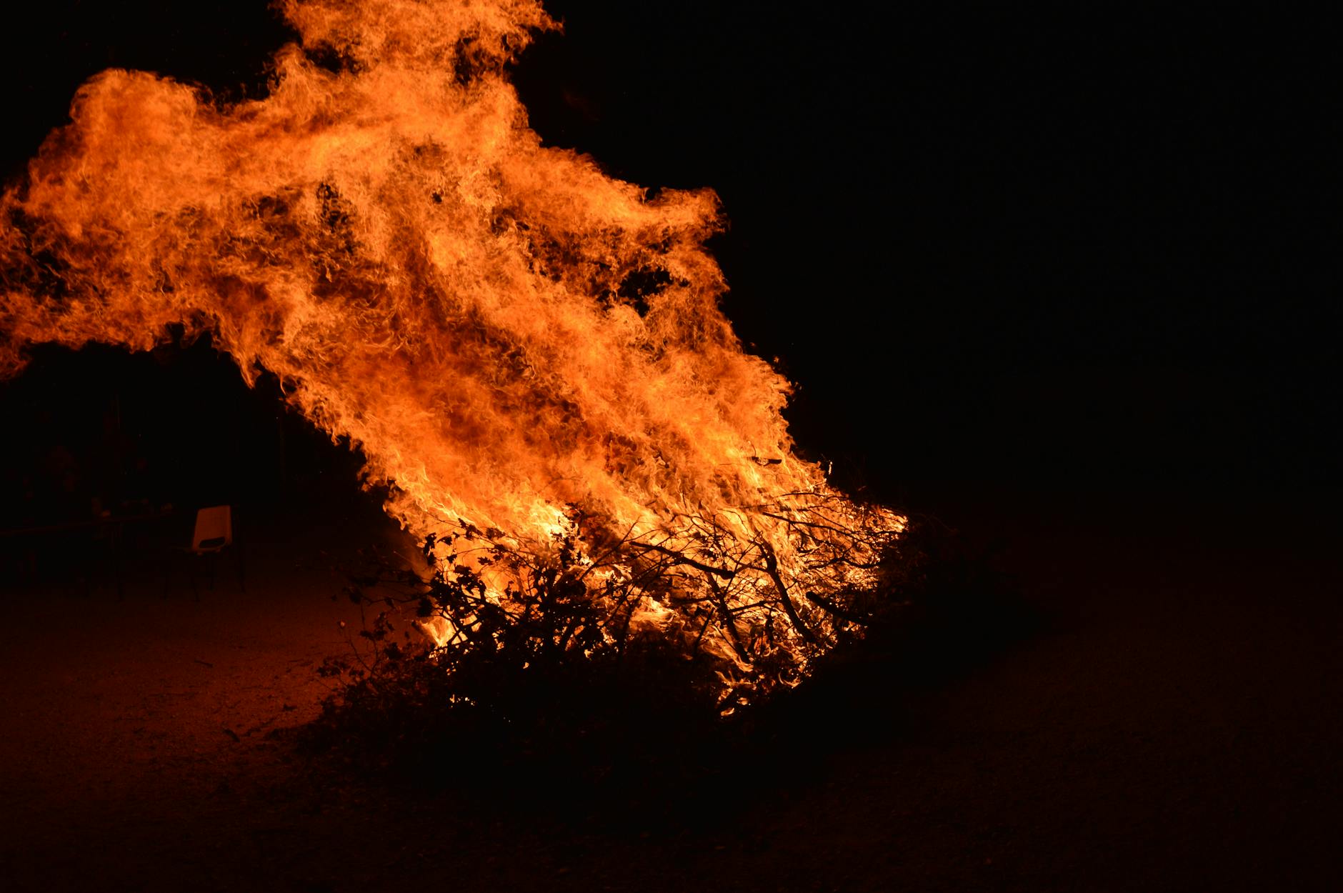 A large bonfire blazing against the dark night sky on Guy Fawkes Night