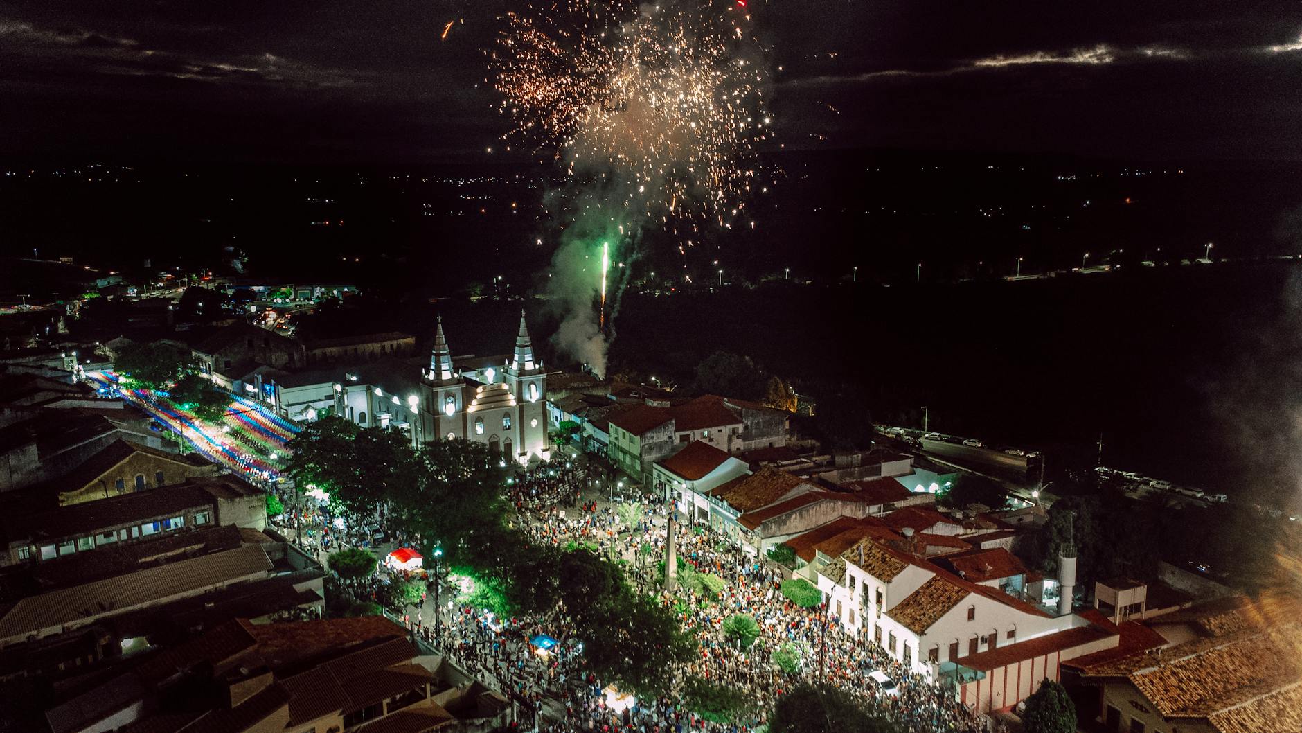 Fireworks lighting up the night sky over an English town