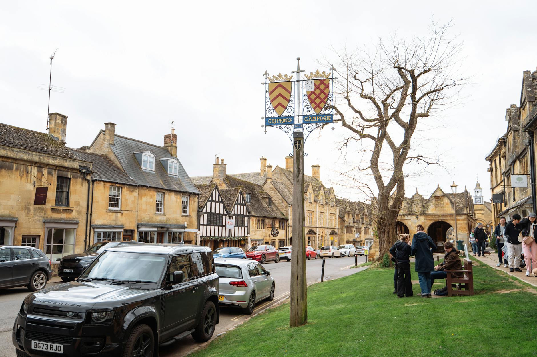 Honey-coloured stone buildings curving along the High Street in Chipping Campden, a Cotswold market town