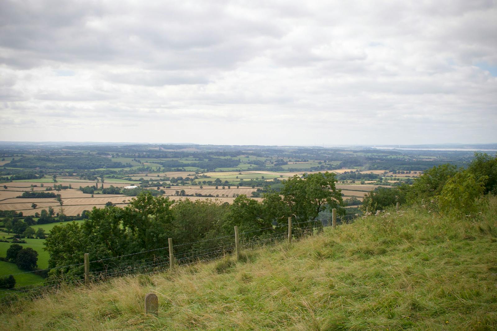 Rolling green hills and farmland of the Cotswolds National Landscape near Wotton-under-Edge