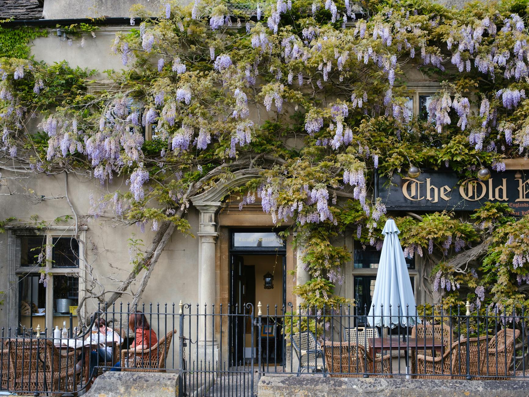Picturesque wisteria-clad Cotswolds country pub exterior