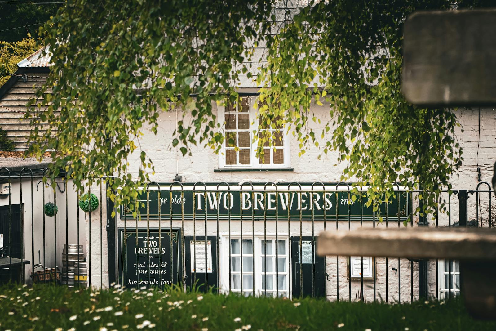 A traditional village pub in a rural English town, in the style of a Cotswolds local
