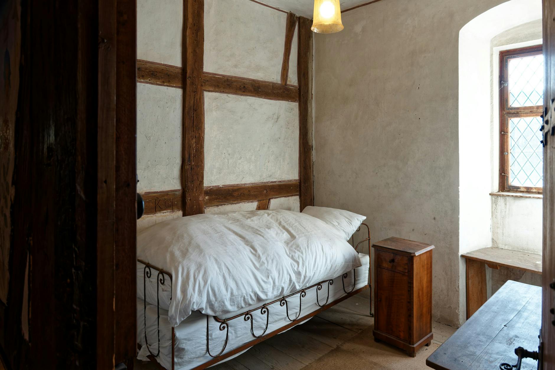 Cosy rustic bedroom in a romantic Cotswolds cottage for two