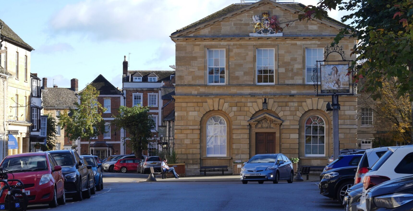 Woodstock Town Hall of 1766 in the market square with Georgian frontages and the Bear Hotel sign