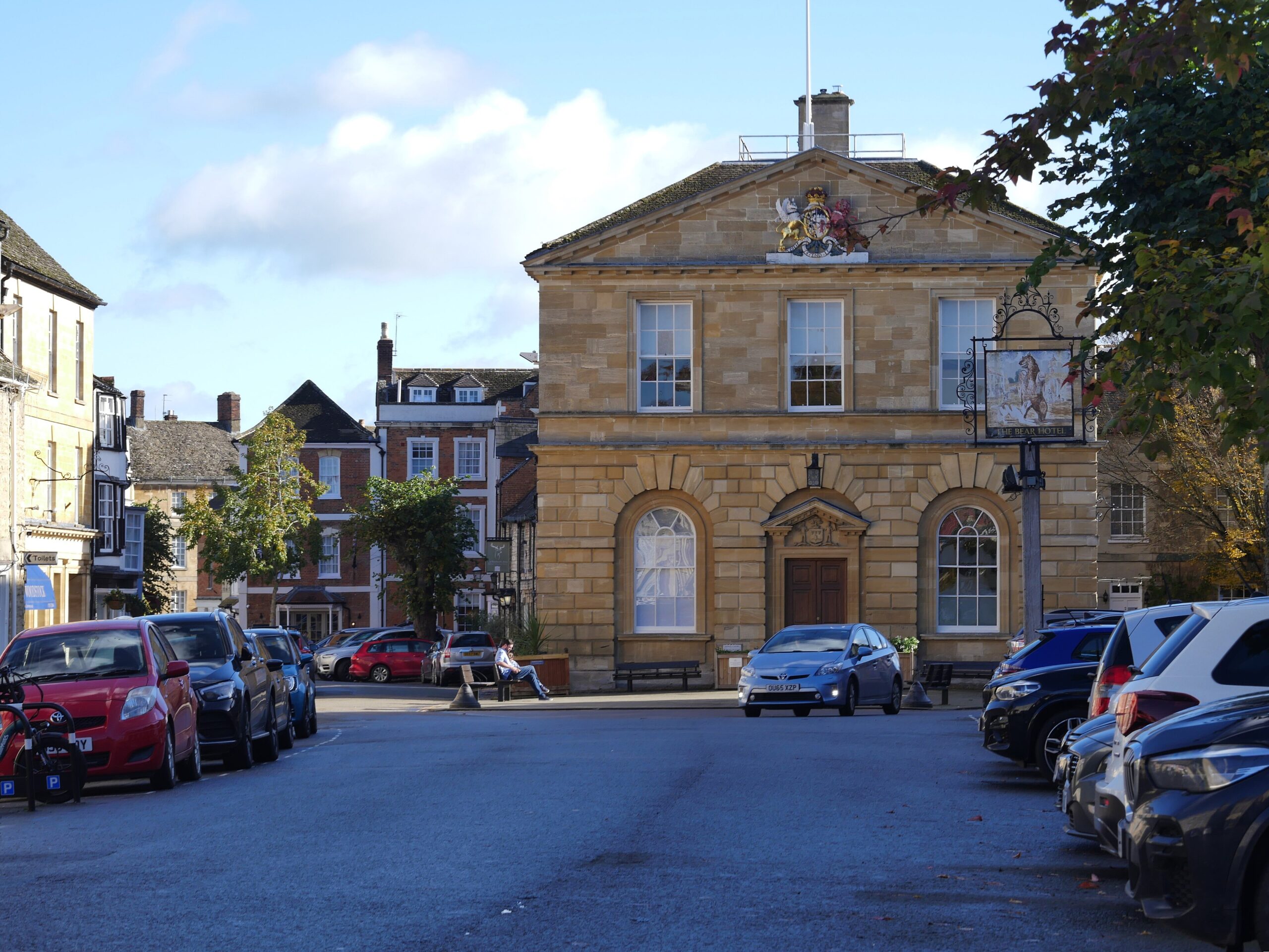 Woodstock Town Hall of 1766 in the market square with Georgian frontages and the Bear Hotel sign